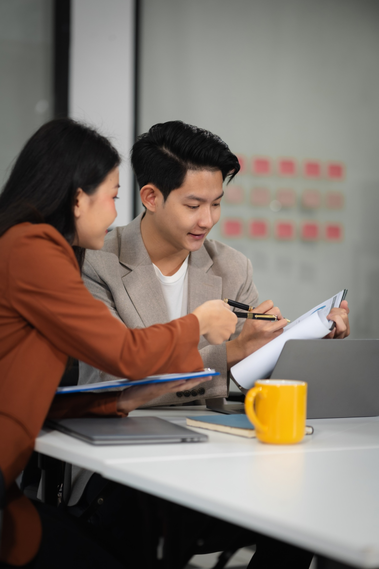 financial-asian-advisor-showing-plan-of-investment-to-clients-in-the-consultancy-office-1-4