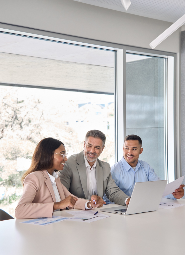 happy-diverse-business-employees-team-working-at-group-meeting-using-laptop-1-1